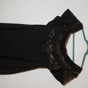 Off the shoulder black dress with gold decorations